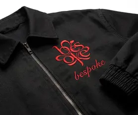 Contrasting red chain-stitch chest embroidery