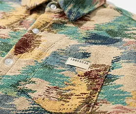 Button placket construction, chest label detailing