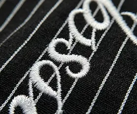 High-density chest script embroidery