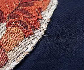 Raw frayed patch border finish